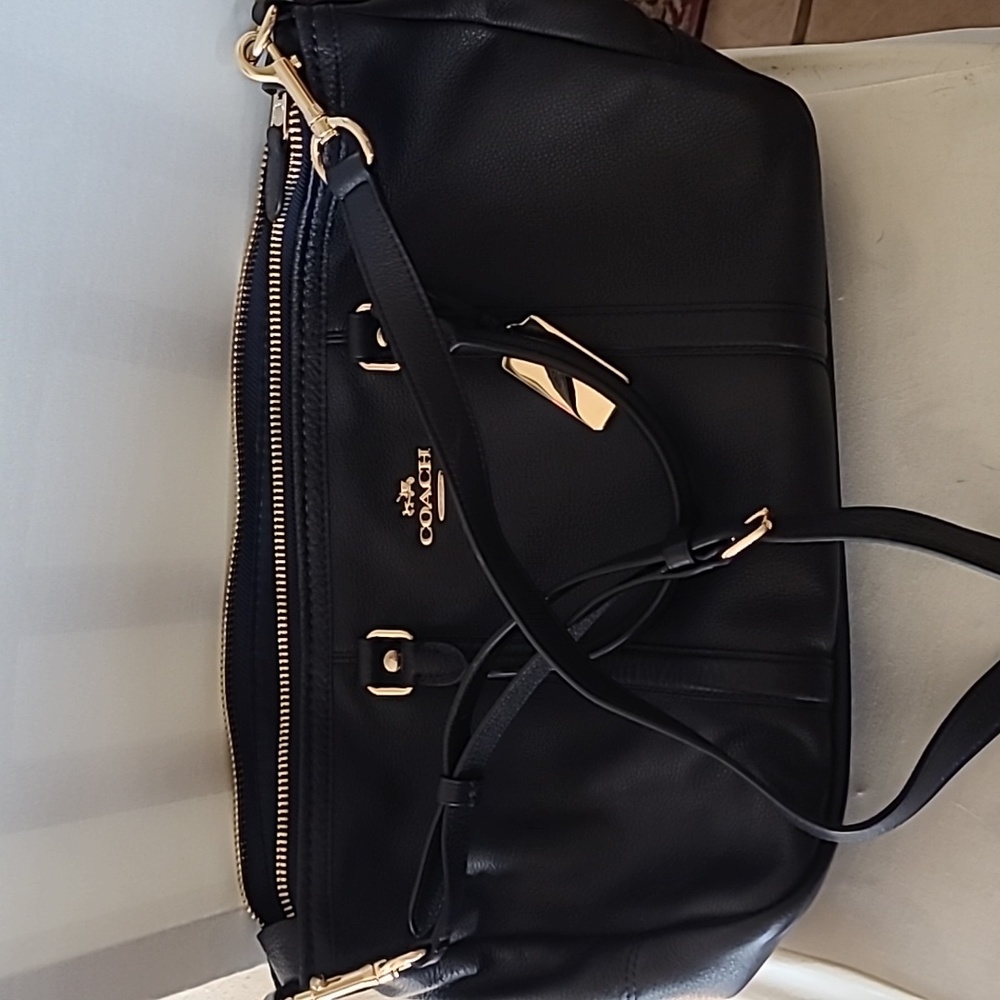 Coach purse (small duffel). Dark Navy. Inside pockets. hand or shoulder straps